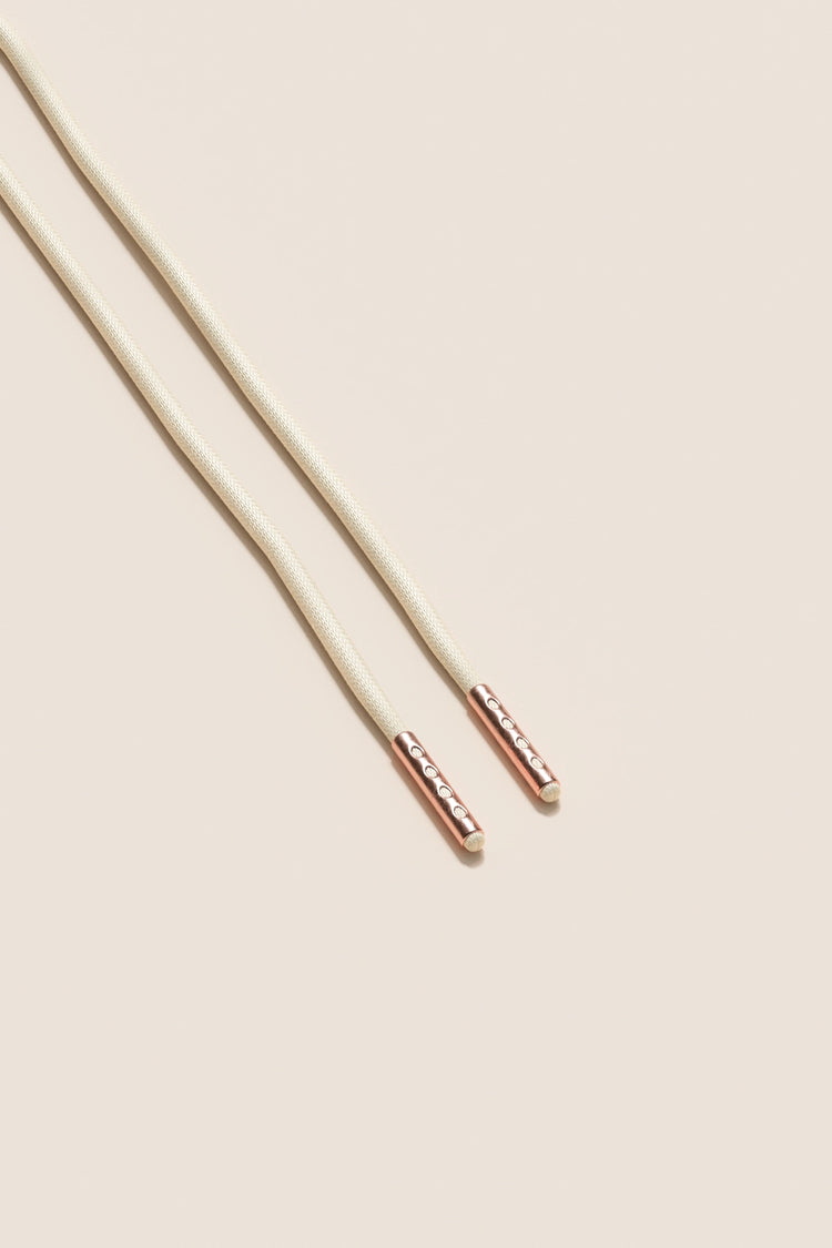 Senkels Cream 2.5mm Round Waxed Shoelaces with Rose Gold Aglets